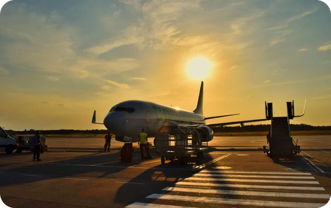 Aircraft on runway during sunset